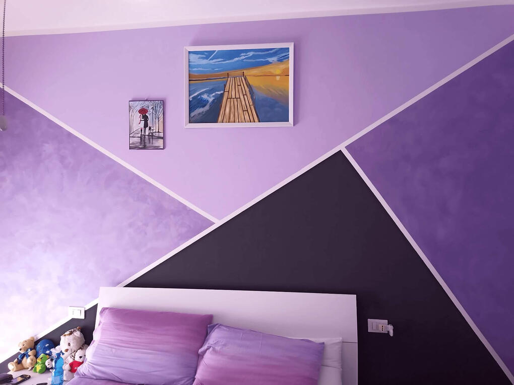 Motivo a triangoli con velature della Sikkens per camera da letto